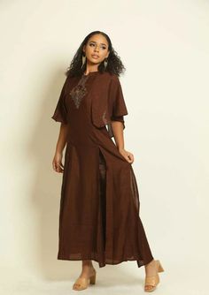 This stylish two-piece dress is perfect for any occasion. Expertly designed in brown with delicate embroidery, it is sure to make you stand out. Add a touch of elegance to your wardrobe! Product Details • Component: 2 • Pattern: Embroidery • Type Of Work: Floral Embroidery • Neckline: Round • Sleeve Type: Half Sleeves • Fabric: Silk • Color: Brown • Other Details: • Embroidery work • Occasion: Formal event, Party wear Elegant Brown Dress With Intricate Embroidery, Festive Brown Embroidered Dress, Brown Sharara, Bohemian Brown V-neck Boho Dress, Brown V-neck Patchwork Dresses