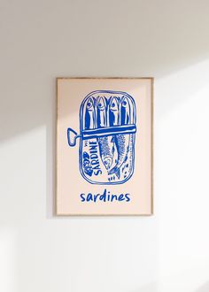 a blue and white print hanging on the wall