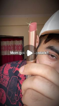 a person holding a lipstick in front of their face with the caption mom got u lipstick