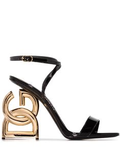 Black leather DG Pop Keira 105mm sandals from DOLCE & GABBANA featuring buckle-fastening ankle strap, single toe strap, branded leather insole and signature DG Pop high heel. | Dolce & Gabbana Pop Keira 105mm sandals Chic High Heels, Dolce Gabbana Shoes, Dolce E Gabbana, Designer Sandals, Sandals Black, Trendy Shoes, Sneaker Heels, Designer Heels, Dolce & Gabbana