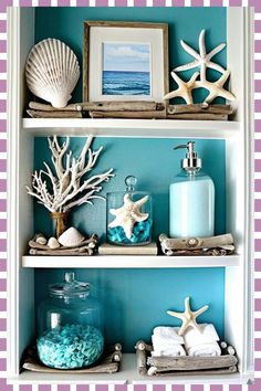 the shelves are decorated with shells, seashells and other items in blue and white