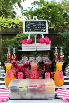 a table topped with drinks and desserts