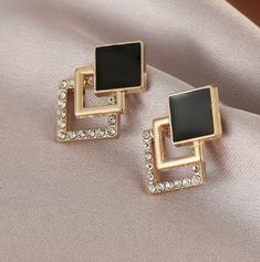 Brand New With Tags Black Enamel Geometric Earrings With Rhinestones. Gold tone. For pierced ears. Comes with back stops, on display card. Luxury Gold Earrings With Black Enamel, Ear Rings, Display Cards, Geometric Earrings, Pierced Ears, Black Enamel, On Display, Black Background, Ear Piercings