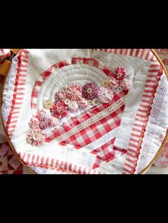 a close up of a plate on a table with red and white checkered cloth