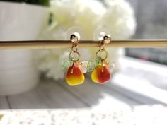 "glass pear drop earrings with cute white flower and green leaf Material: glass pear, arcylic leaf and flower, gold plated stud or hook length: about 1.25-1.5\" Contains small parts. Use caution when giving to young children less than Age 3 Please keep them away from moisture. If you have any questions, please feel free to contact me. Thanks :)" Gold Drop Earrings With Fruit Design, Gold Fruit Design Drop Earrings, Fruit Design Drop Earrings For Gift, Fruit Design Drop Earrings As Gift, Trendy Fruit Design Drop Earrings, Green Dangle Earrings With Fruit Design, Trendy Dangle Earrings With Fruit Design, Cute Fruit Design Drop Earrings, Green Drop Earrings With Fruit Design