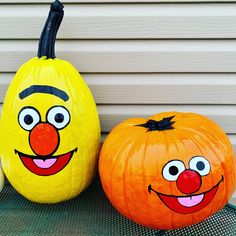 two pumpkins painted to look like cartoon characters