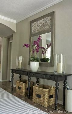 a table with baskets and flowers on it