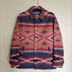 The Pendleton Company Founded Its First Mill In 1893 And This Long Legacy Underlies Each Of Its Pieces. The Label Style On This Well Cared For Coat Indicates That The Jacket Was Produced Sometime Between 1994 And 2009. Brand: Pendleton Made In Usa, Pendleton Woolen Mills, Portland, Oregon Rn29685 “High Grade Western Wear” Size: S Men’s Length: 29” Mid Shoulder Seam Down To Hemline Pit To Pit: 22” Shoulder Seam To Shoulder Seam: 19.5” Sleeve Length: 24” Colors: Navy, Rusty Red, Cream, Brown, Blac Wool Jacket Men, Pendleton Jacket, Pendleton Woolen Mills, Southwest Style, Wool Jacket, Portland Oregon, Jacket Coat, Western Wear, Black Fabric