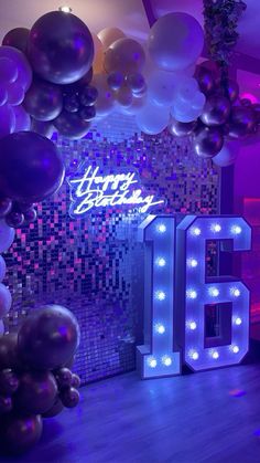 balloons and lights decorate the entrance to a party