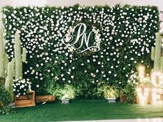 the wedding backdrop is decorated with flowers and greenery