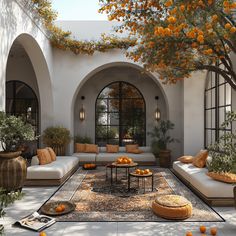 an outdoor living room with oranges on the ground