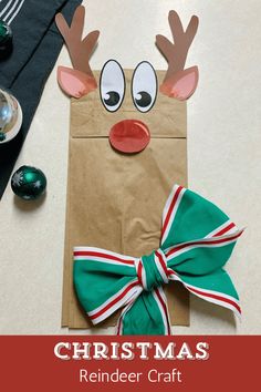 a paper bag with reindeer's head on it and the words christmas reindeer craft