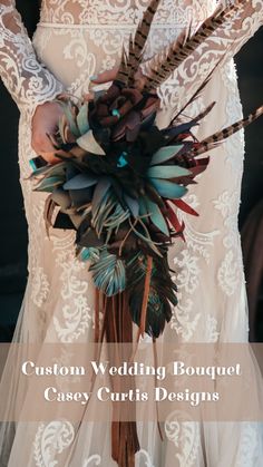 a woman in a wedding dress holding a bridal bouquet with feathers on it and the words custom wedding bouquet casey curtis designs