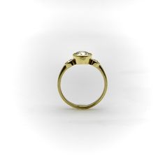 This is part of Chairish’s Fine Jewelry assortment.  The design for this ring came into being when Kirsten’s Corner replicated a ring for one of our clients. The ring had belonged to her mother, but was damaged past the point of no return, so she wanted to replicate a version of the special piece. The design is a simple 18k gold trilogy ring with a beautiful rounded shank. The centerpiece is a 6.7 mm Old European Cut diamond, flanked by 2.9 mm side stones. The ring is elegantly bezel set, and th The Point Of No Return, Trilogy Engagement Ring, Point Of No Return, Trilogy Ring, Engagement Ring Size, Three Stone Ring, Engagement Ring Sizes, European Cut Diamonds, Three Stone Rings