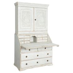 an old white wooden desk with drawers and cupboards on the top, isolated against a white background