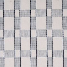 a blue and white checkered fabric with small squares on the top, as well as lines