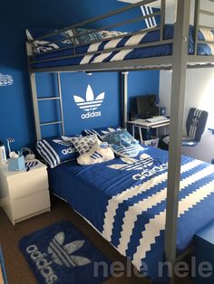 a blue and white bedroom with a bunk bed