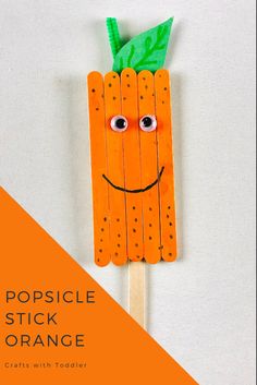 popsicle stick orange with green leaf and smiling face