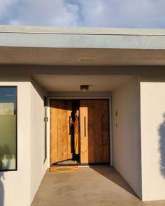 a person standing in the doorway of a building