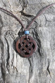 This beautiful and unique hand-carved Celtic Infinity pendant will be made for you, or a loved one, in my studio on the West of Ireland. This delicately carved Celtic necklace features a piece of Rosewood, recycled from musical instruments constructed by a local luthier. As a musician myself, I take enormous satisfaction in creating a piece of jewellery whose inherent wood has previously featured in a beautiful hand-made guitar! Celtic knots date back to the 3rd to 4th century B.C. They were use Symbolic Carved Brown Jewelry, Traditional Mahogany Jewelry As Gift, Traditional Mahogany Jewelry For Gifts, Brown Carved Spiritual Jewelry, Spiritual Brown Carved Jewelry, Celtic Knot Necklace, Celtic Necklace, Infinity Pendant, Celtic Knots