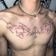 a man with a tattoo on his chest