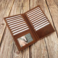 an open wallet sitting on top of a wooden table