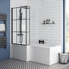 a bathroom with blue walls and white tile