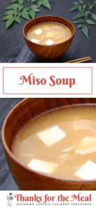 two bowls of miso soup with chopsticks on the side