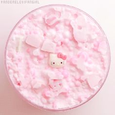 a hello kitty rice bowl is shown in pink and has marshmallows on it