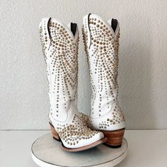 Lane Dolly Boots In Matte White With Gold Rhinestones And Studs. The Details On These Are Insane! Condition: These Are Samples. Ther Is A Small Defect On The Left Toe And Tine Darl Spot. These Will Come In A Boot Box And Fit True To Size. The Leather Is Super Soft! ****All Of The Pictures Are Of The Boots You Will Receive. These Are Genuine Leather. Brand: Lane Boots Style: Dolly Boots Part#: Lb0511c Color: Matte White Size: 7.5 B Msrp: $1495 Shaft: 15" Heel: 2 2.5" Snip Toe Ankle Circumference: White Embellished Boots With Pointed Toe, Elegant Embellished White Boots, Western White Embellished Boots, White Western Party Boots, White Leather Boots With Rhinestones, White Embellished Snip Toe Boots, White Rhinestone Boots With Round Toe, White Embellished Boots With Round Toe, Luxury White Party Boots