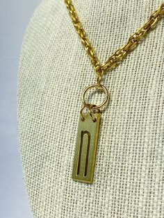 Vintage type set initial letter to personalize your everyday. Each brass letter is unique in its own way and sealed with a clear coat finish to prolong the oxidation process. This 'n' is paired with a vintage upcycled chain. Vintage Charm Initial Pendant Jewelry, Vintage Initial Pendant Jewelry With Charm, Vintage Initial Pendant Charm Jewelry, Vintage Handmade Initial Pendant Jewelry, Vintage Brass Necklace With Coin Pendant, Vintage Gold Coin Necklace With Chain, Vintage Yellow Gold Coin Necklace With Adjustable Chain, Vintage Brass Choker Necklace, Vintage Coin-shaped Brass Necklaces