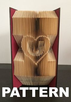 an origami folded book with the words pattern on it