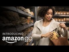 a woman holding a bag and looking at an item in a store with the caption cashier less amazon go