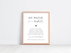 a framed poster with the words, my water is love and a heart in it