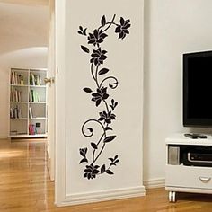 a living room with a flat screen tv sitting on top of a white entertainment center