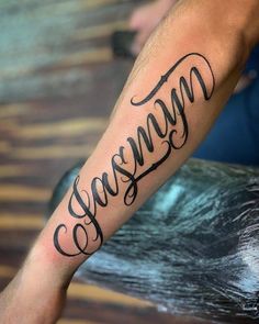 a man's arm with the word samma written in cursive writing