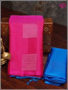 This Kanjivaram/ Kanchipuram soft silk saree is an elegantly crafted handloom saree with a Pink and Blue combination and borderless fashion. Intricate motifs in silver zari adorn the pallu and alternate gold and silver zari motifs grace the body. Perfect for any occasion, this saree is sure to make a lasting impression. Its handmade tassels give it a traditional and timeless look. It comes with an unstitched plain blouse piece. Fall and Pico - done Handmade tassels Blouse - unstitched Handloom s Diwali Pink Silk Mark Certified Saree, Festive Pink Silk Mark Certified Saree, Pink Silk Mark Certified Saree, Silk Mark Certified Pink Saree, Pink Silk Mark Certified Traditional Wear For Diwali, Traditional Pink Silk Mark Certified Saree, Pink Traditional Silk Mark Certified Wear, Pink Silk Mark Certified Traditional Wear, Tassels Blouse