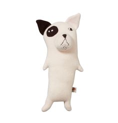 a white stuffed animal with black eyes on it's head and nose, standing upright