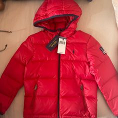 100% Real/Authentic Polo Ralph Lauren Puffer Jacket Brand New Never Won In Plastic Original Price $125 Size Is In Boys Not Girls Red Hooded Puffer Jacket With Pockets, Red Puffer Jacket With Detachable Hood, Red Hooded Puffer Jacket With Detachable Hood, Hooded Red Puffer Jacket For Outdoors, Red Hooded Puffer Jacket For Outdoor, Red Outerwear With Adjustable Hood For Cold Weather, Ralph Lauren Puffer Jacket, Ralph Lauren Puffer, Boys Puffer Jacket