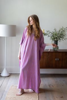 A highly versatile, chic caftan created for today's modern woman. This breezy garment will take you from vacation as the ideal coverup at the pool or beach, then out to dinner in the evening - simply add a clutch and sandals. Or, wear it around the house for a comfortable take on a house dress. We love it for hosting dinner parties! Ideal for pregnant women, new moms, and women of all ages, shapes and sizes. 54 inches length 100% Rayon Block-printed using natural dyes Made in India Removable dou Chic Pink Kaftan For Beach Cover-up, Chic Daywear Kaftan For Spring, Chic Long Kaftan For Beach, Breezy Spring Kaftan, Chic Long Kaftan For Beach Cover-up, Summer Beachwear Kaftan For Daywear, Chic Long Kaftan For Beach Season, Chic Long Summer Kaftan, Chic Oversized Kaftan For Spring