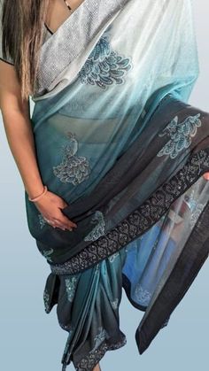 Description: (Fh_Sar006) Elevate your style with our exquisite ready-made saree in a stunning combination of turquoise blue, black, and grey. Crafted from fine imported fabric, this saree is a masterpiece of elegance and sophistication. The entire ensemble is adorned with intricate diamond work, adding a touch of glamour to your look. ✨ Key Features: Fabric: Made from fine imported fabric, ensuring a luxurious and comfortable drape. Colors: A captivating blend of turquoise blue, black, and grey, creating a harmonious and chic color palette. Diamond Work: Adorned with meticulous diamond work all over the saree, enhancing its opulence. 👗 Ready-to-Wear Perfection:Experience the ease of dressing with our ready-made saree. No fuss with pleats or drapes--just slip into this beautifully crafted Blue Fitted Pre-draped Saree With Self Design, Bollywood Style Designer Turquoise Saree, Traditional Fitted Turquoise Saree, Fitted Traditional Turquoise Saree, Turquoise Semi-stitched Saree With Traditional Drape, Turquoise Fitted Saree With Zari Work, Elegant Turquoise Dupatta With Zari Work, Semi-stitched Turquoise Saree With Traditional Drape, Unstitched Turquoise Saree For Wedding