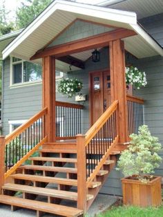 a porch with steps leading up to the front door