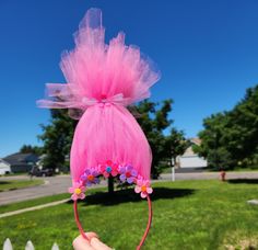 Get ready to channel your inner princess with this Trolls Hair Inspired Headband! Perfect for kids and adults alike, this whimsical headband features vibrant and colorful faux hair that will instantly transform your look. Whether you're heading to a themed party, festival, or just want to add a fun touch to your outfit, this headband is sure to make a statement. Embrace your playful side and let your hair down with this unique accessory! These are made with tulle, felt flowers, hot glue, and a thin headband.  These are handmade so there might be slight imperfections.  The headband fits MOST and is pre-made so I cannot guarantee the fit.  These are ready to ship and ship within 1 business day of purchase.  I DO NOT accept cancellations, returns or exchanges. If you have any questions, pleas Trolls Inspired Outfit, Trolls Hair, Hair Inspired, Headband Fits, Faux Hair, Hair Headband, Let Your Hair Down, Hair Down, Party Festival