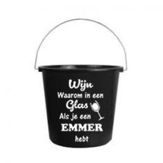 a black bucket with white writing on it and a wine glass in the bottom corner