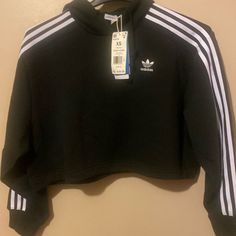 Women Brand New Adidas Black And White Cropped Hoodie Fall Sportswear Hoodie With Three Stripes Branding, Adidas Fall Sweatshirt With Three Stripes, Adidas Tops With Ribbed Cuffs For Streetwear, Sportswear Top With Three Stripes For Fall, Adidas Casual Hoodie With Three Stripes, Adidas Long Sleeve Athleisure Sweatshirt, Casual Adidas Hoodie With Three Stripes, Adidas Athleisure Long Sleeve Sweatshirt, Black Sporty Hoodie For Spring