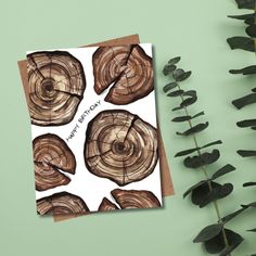 a birthday card with wood slices on it