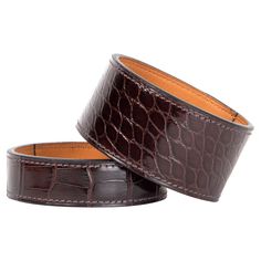 100% authentic Hermes 'Neo' bangles in Havane (dark brown) shiny crocodile leather. Set of two PM & GM. Have been worn and are in excellent condition. Come with box. Measurements Tag Size M Circumference 19.5cm (7.6in) All our listings include only the listed item unless otherwise specified in the description above. Luxury Brown Bangle Bracelet, Formal Brown Leather Bracelet, Hermes Bracelet, Modern Bracelets, Crocodile Leather, Bangle Bracelet, Havana, Dark Brown, Bangle Bracelets