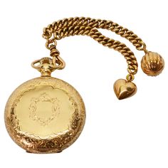 Own a bit of history with this exceptional ladies heirloom timepiece from Waltham American Watch Company. This exquisite pocket watch is made of fourteen karat 14K yellow gold and has been meticulously hand engraved on both the back and the front. Attached is a 14 karat yellow gold watch double fob with twin gold curb chains; one finished with a puffed heart charm and the other has a decorative ball charm. Crafted in 1897, this Waltham American Riverside pocket watch is size 6S with 17 jewels an Pocket Watch Aesthetic, Gold Rolex Women, Watch Aesthetic, Waltham Watch, Rolex Watches For Sale, Bear Jewelry, Romantic Era, Vintage Timepiece, Gold Rolex