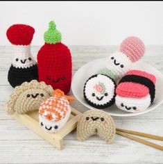 crocheted sushi and chopsticks on a plate