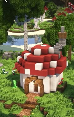 an image of a mushroom house in the middle of some trees and grass with bushes around it